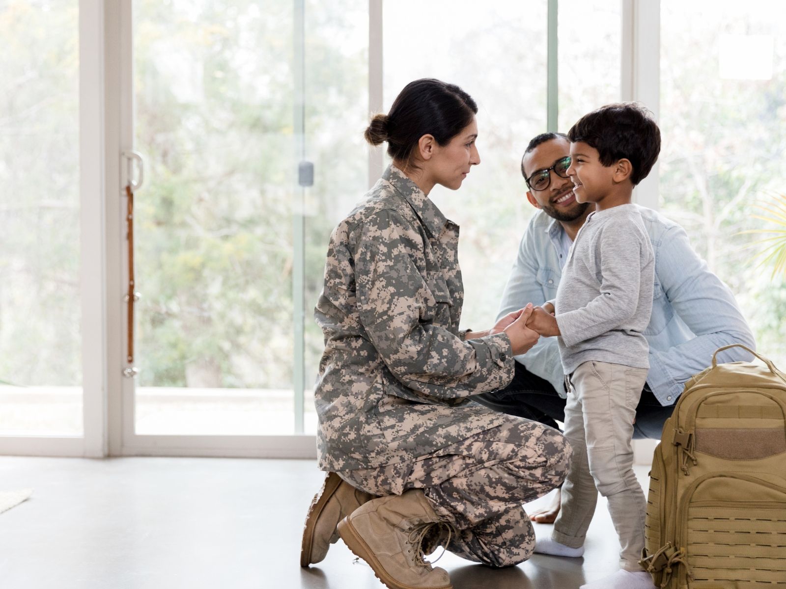 Military service member spending time with family at home.